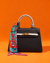 Hermès Kelly Mini Blanco y Negro